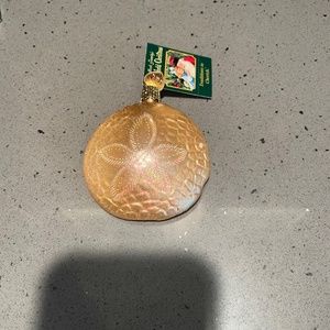 Vintage Merck Family's Old World sand dollar glass ornament